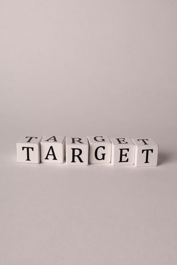 White blocks spelling 'TARGET' on a neutral background with ample copy space.